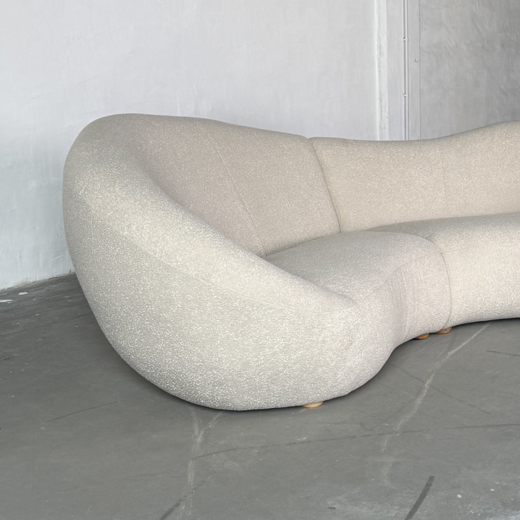 XL curved bouclé sofa